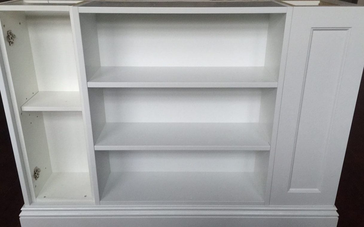 A White Cabinet With the Door Open and Shelves Empty — Truline Cabinets In Cooroy, QLD