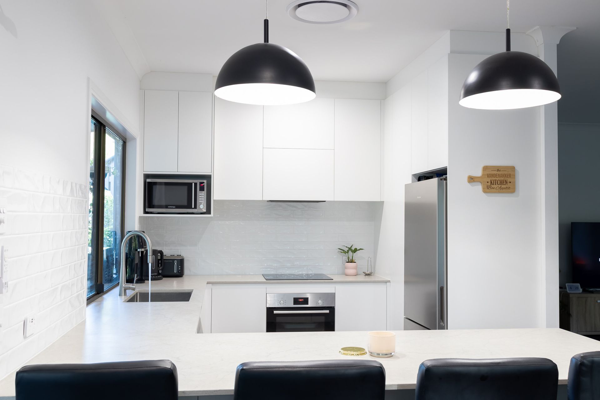 A Vase With Leaves On A Kitchen Island — Truline Cabinets In Tuchekoi, QLD