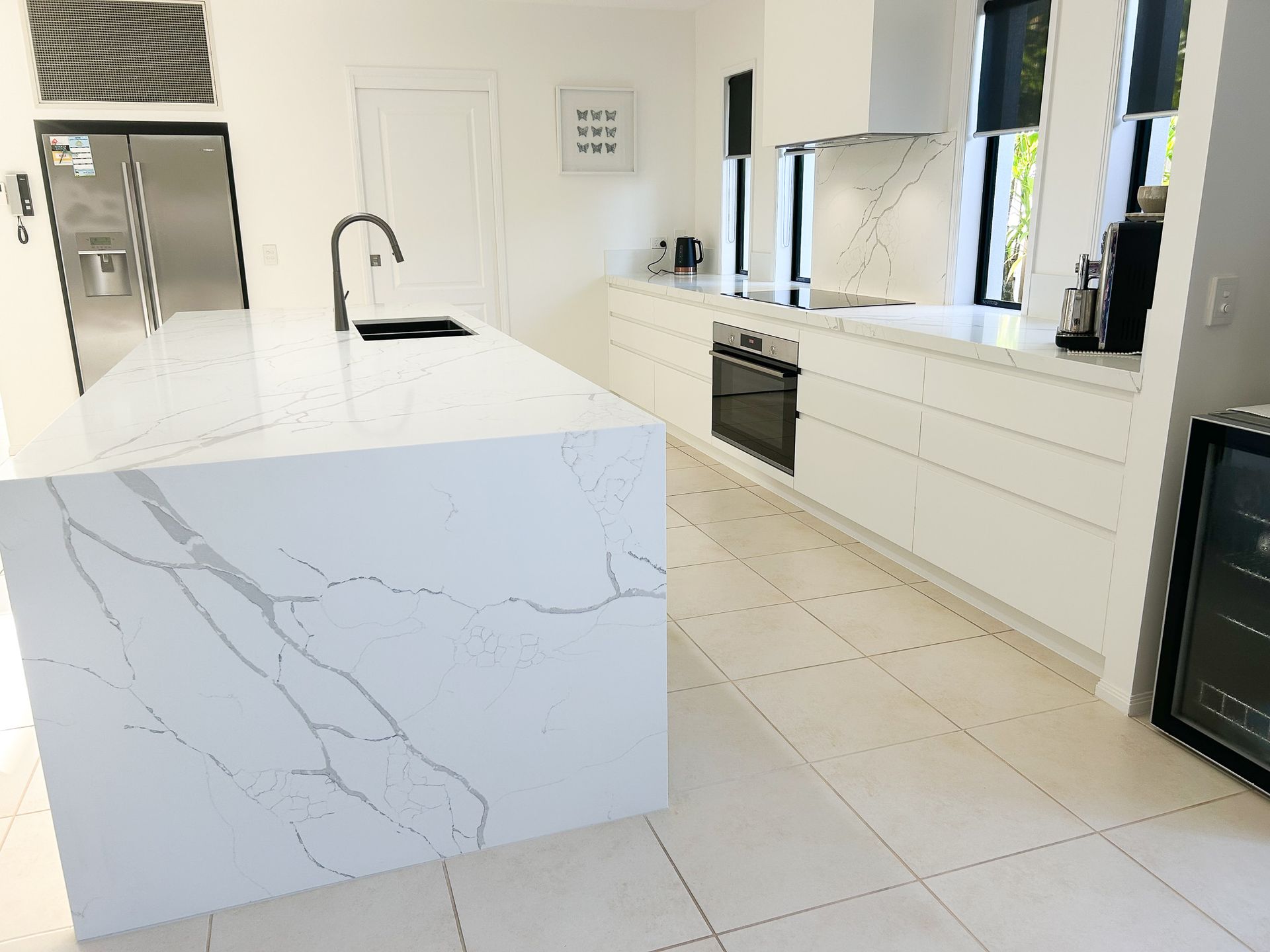 A White Kitchen Island With a Sink — Truline Cabinets In Tuchekoi, QLD