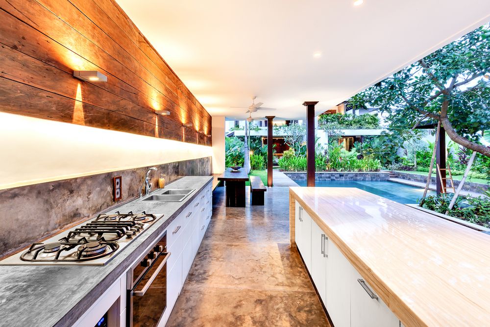 A Kitchen With a Sink and a Open Pantry with Items — Truline Cabinets In Tuchekoi, QLD