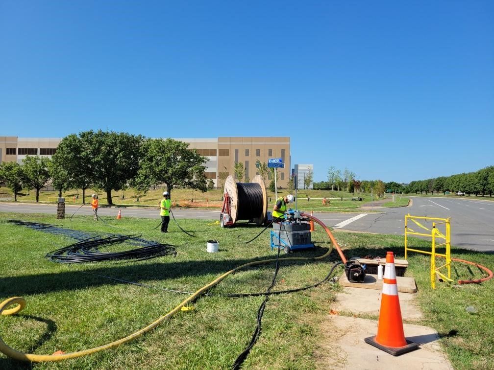 OSP fiber construction crews working on a underground fiber network