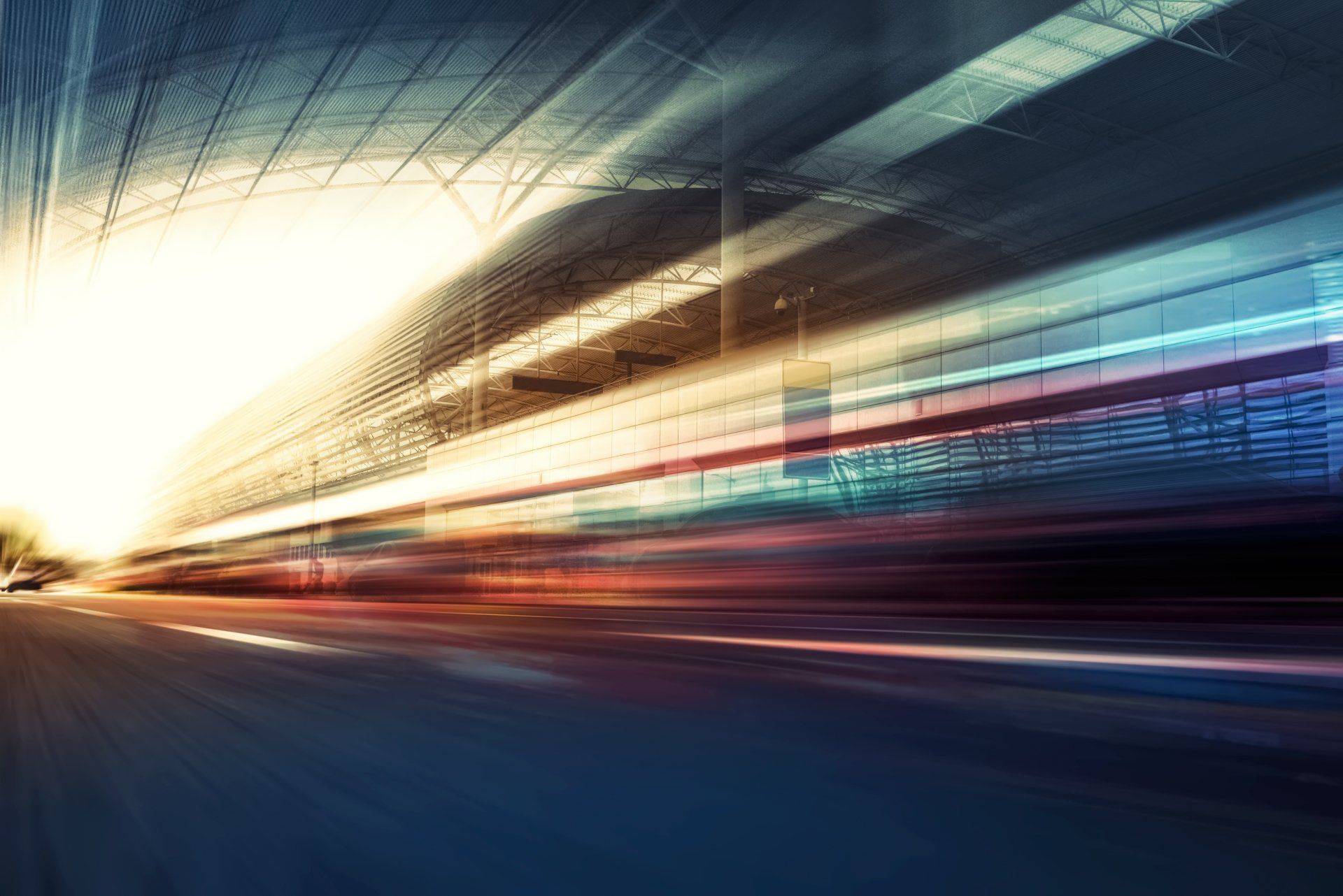 A blurry picture of a train going through a tunnel.