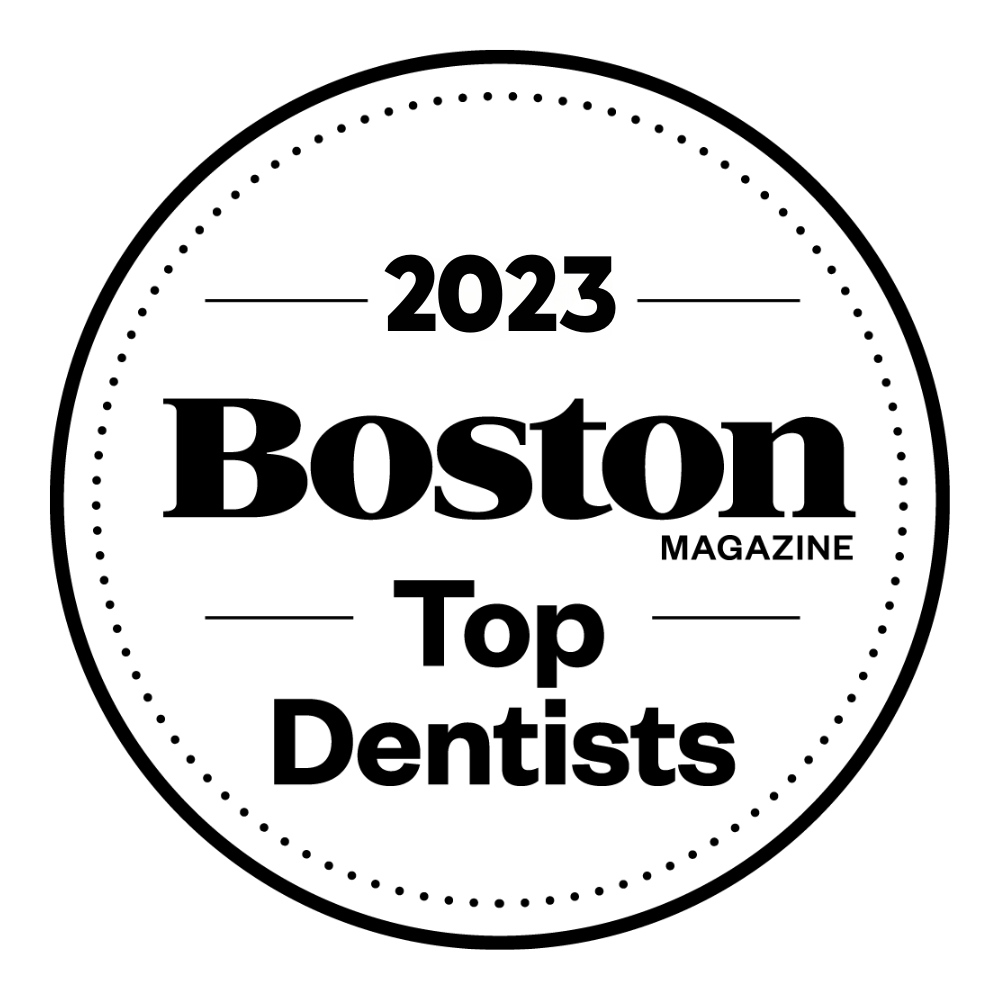 The logo for boston magazine 's top dentists for the year 2023.