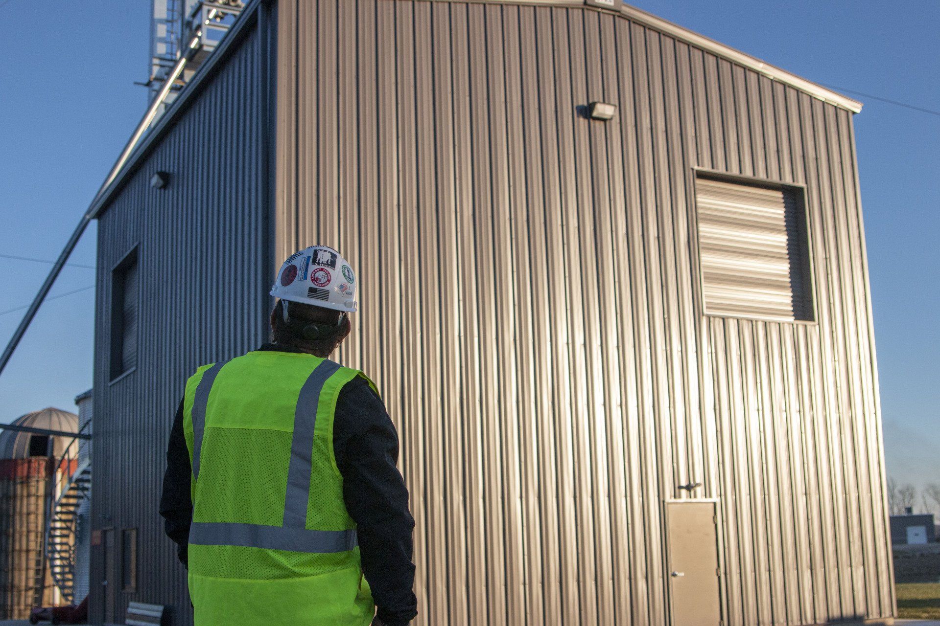construction worker looking at building