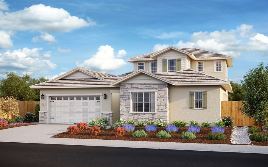 Suburban two-story beige house with a two-car garage and landscaped front yard
