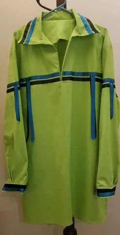 A green shirt with blue stripes is hanging on a hanger.