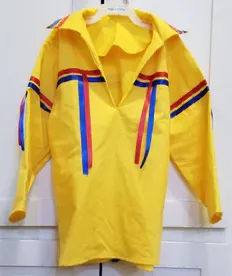 A yellow shirt with red and blue stripes on the sleeves