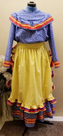 A mannequin is wearing a blue shirt and a yellow skirt.