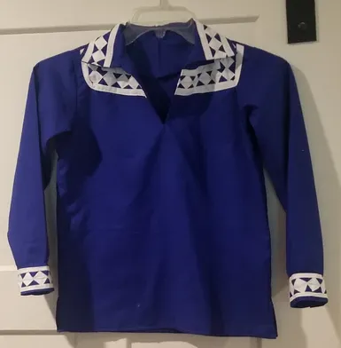 A blue shirt with white trim is hanging on a hanger