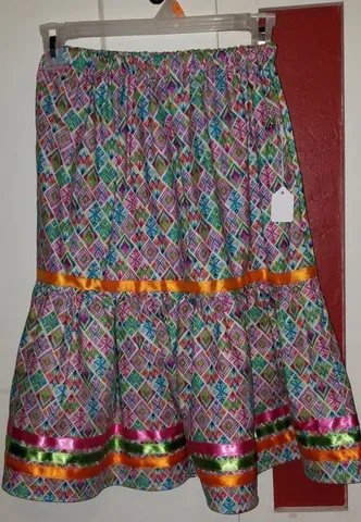 A colorful skirt is hanging on a hanger with a tag on it