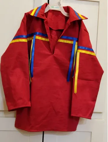 A red shirt with yellow and blue stripes on the sleeves