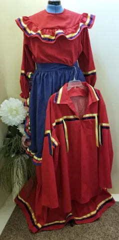 A red dress and a blue skirt are on a mannequin.