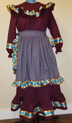 A mannequin is wearing a purple dress with blue and gold trim