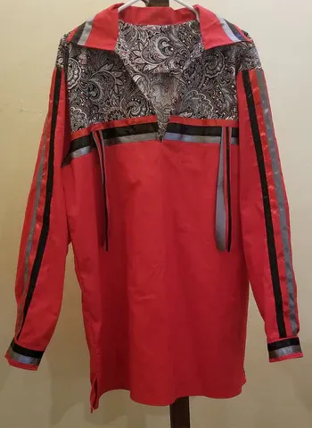 A red jacket is hanging on a hanger.