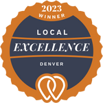 A badge that says `` local excellence '' with two hearts on it.