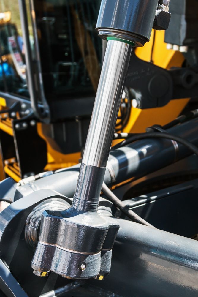 A Close Up of a Hydraulic Cylinder on a Construction Vehicle — Hydrofit Service in Nowra, NSW