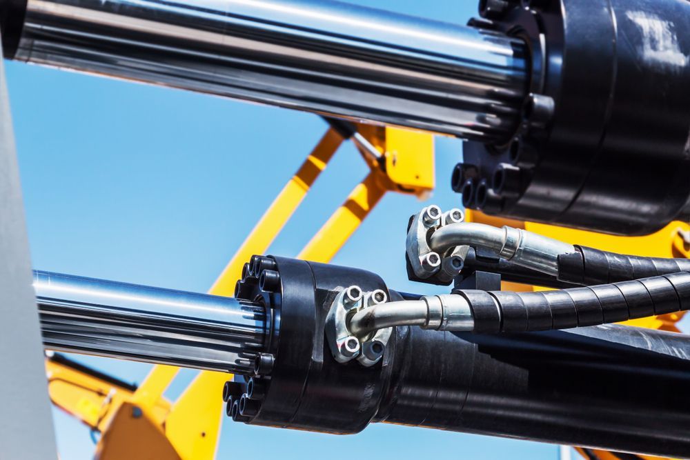 A Close Up of Hydraulic Cylinders and Hoses on a Machine — Hydrofit Service in Shellharbour, NSW