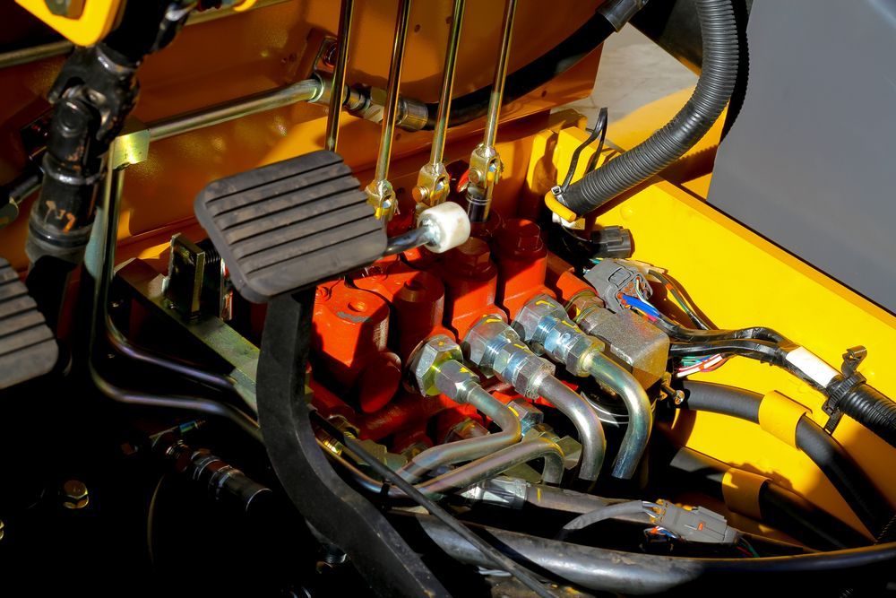 A Close Up of a Hydraulic System on a Yellow Vehicle — Hydrofit Service in Wollongong, NSW