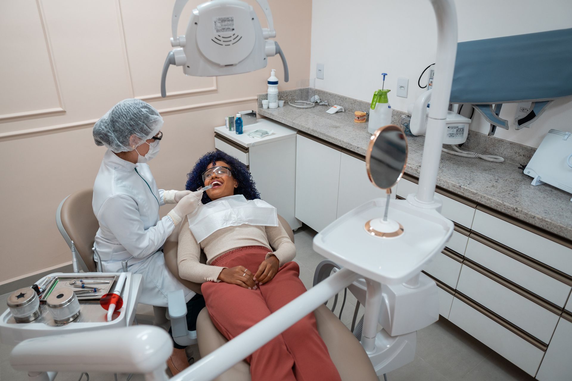 Woman at dentist's office for a check-up, highlighting general dentistry services.