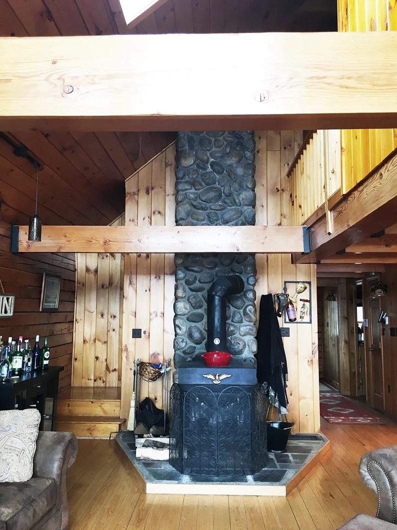 A living room with a fireplace and a couch