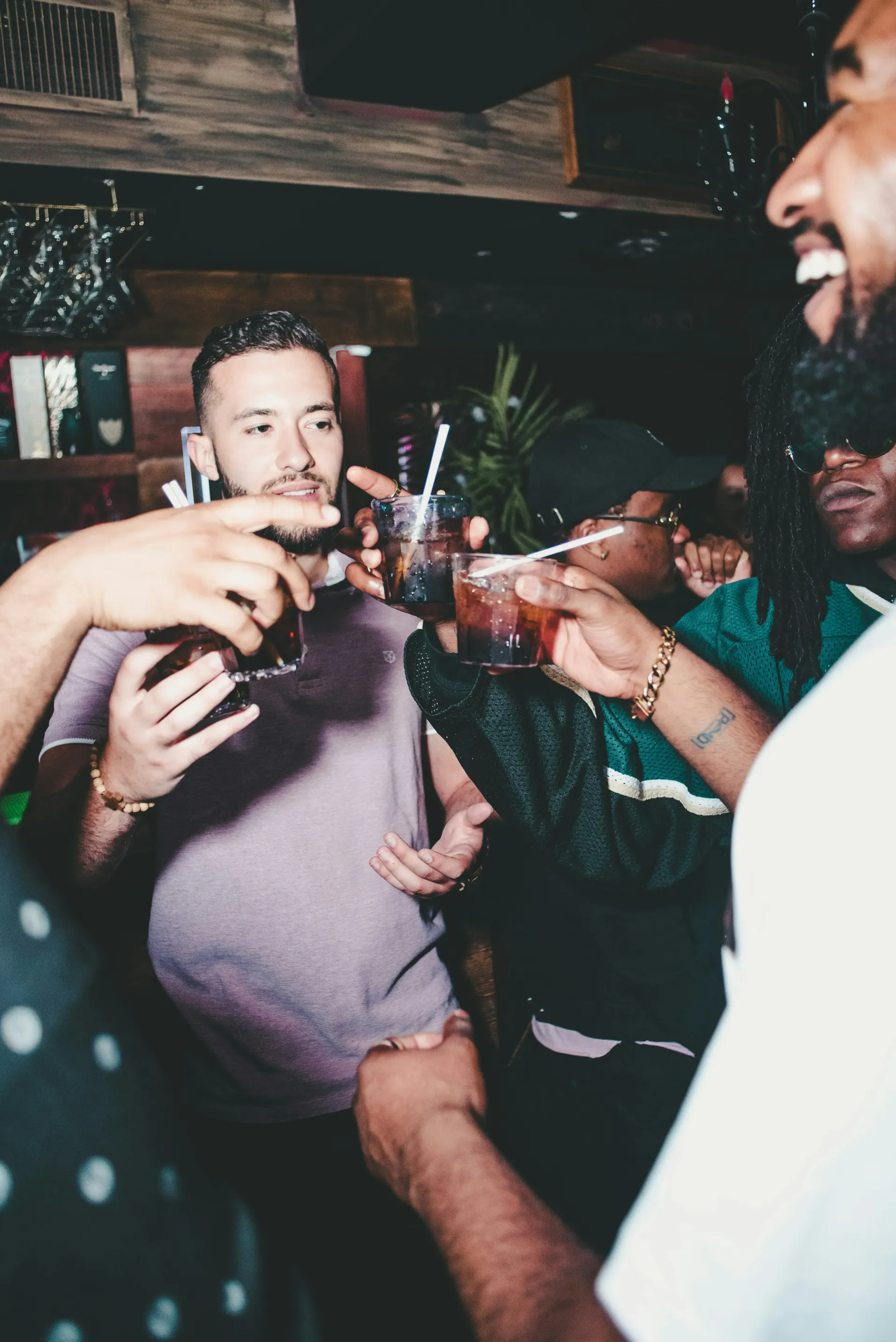 Group of young men enjoying a night out at bachelor party.