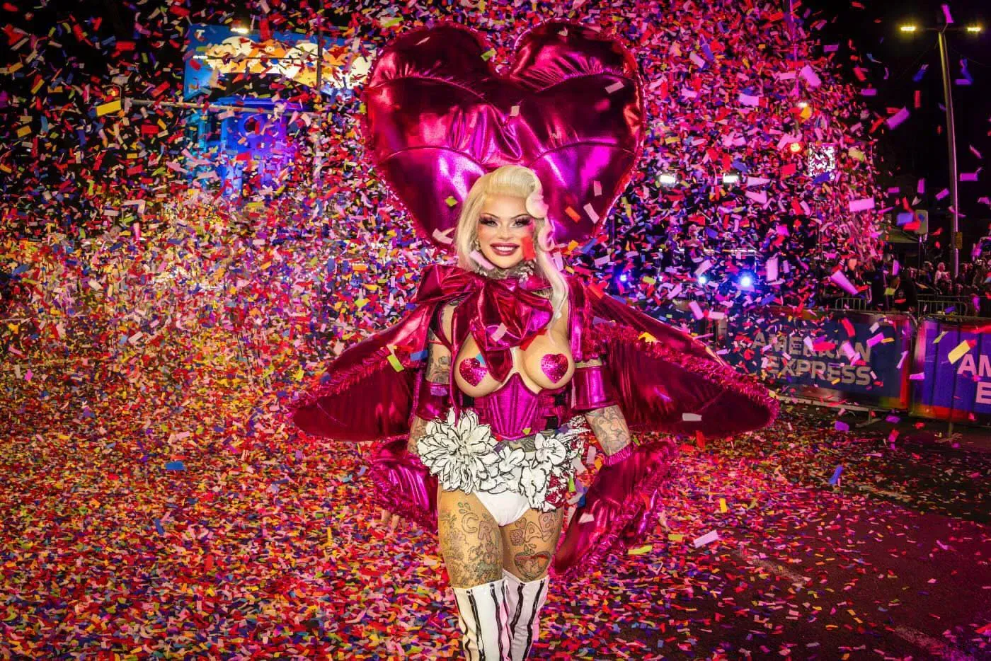 Drag Performer with heart shaped blow up costume at Mardi-Gras parade.