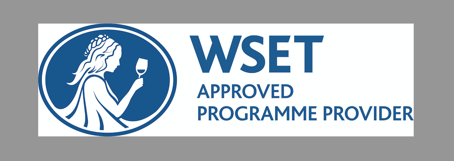 WSET logo with a woman holding a wine glass inside a blue oval, next to