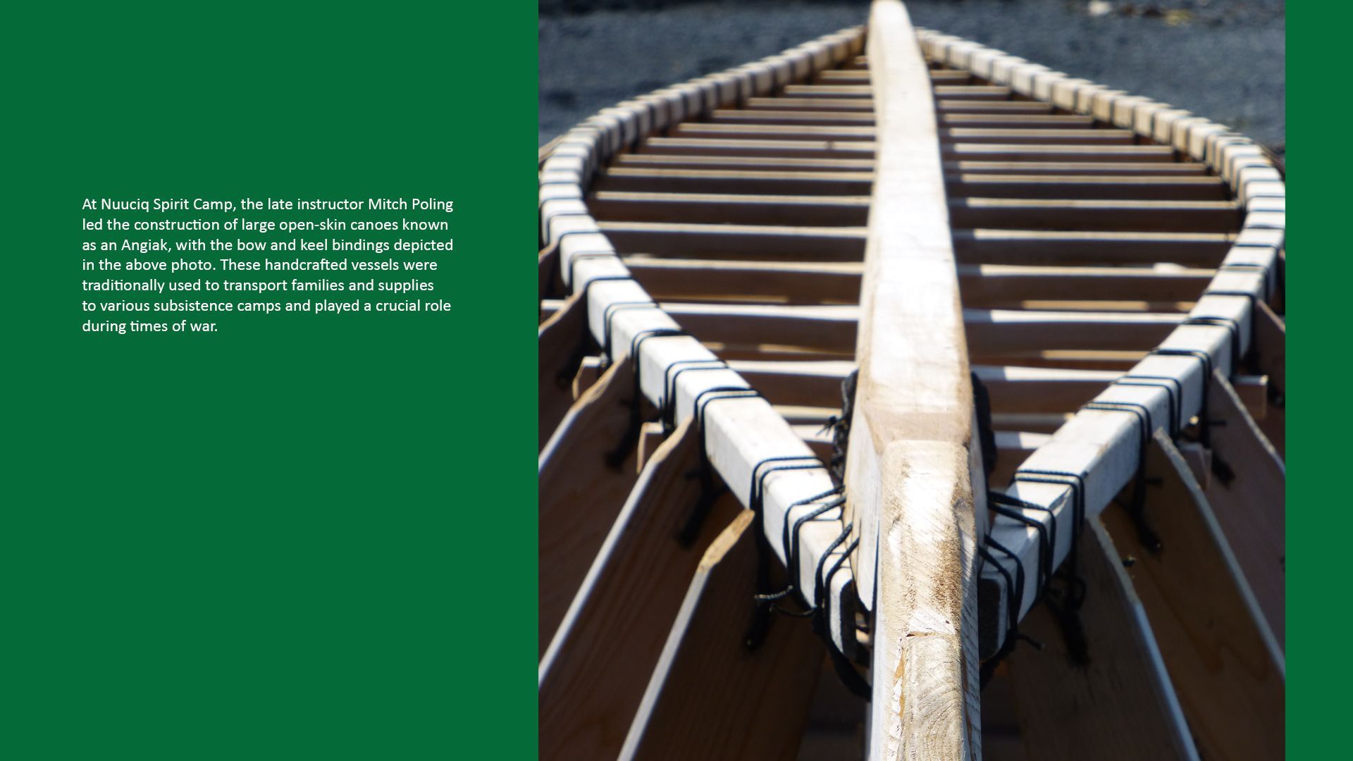 Wooden boat interior, focused on the bow, with dark brown ribs and white trim.