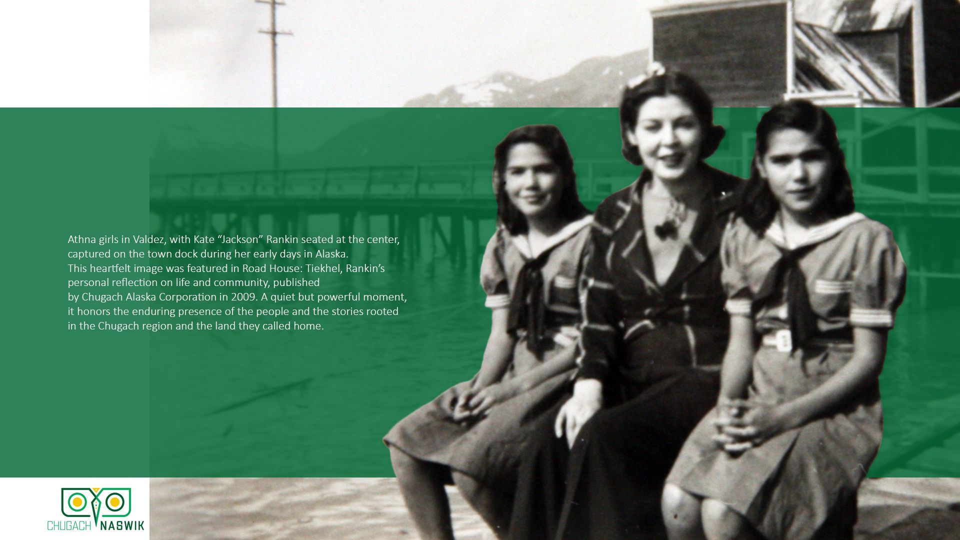 Three people sit outside; two young women flank a woman. All wear dresses and smile.