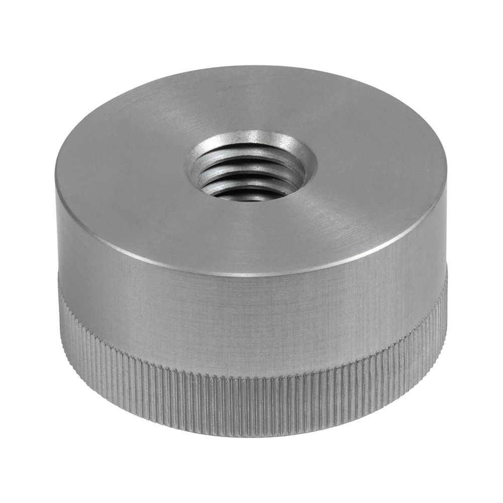 A stainless steel nut with a hole in the middle