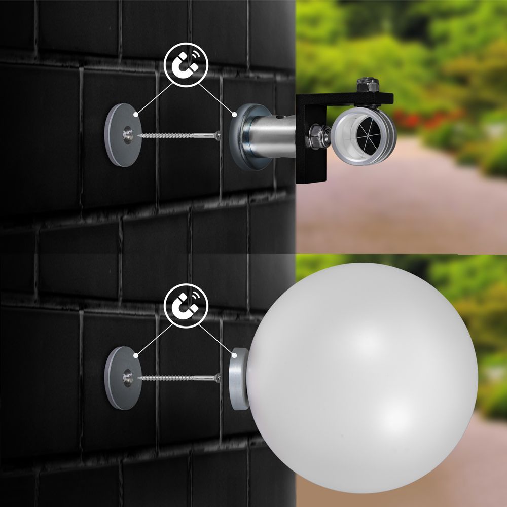 A white ball is attached to a black brick wall