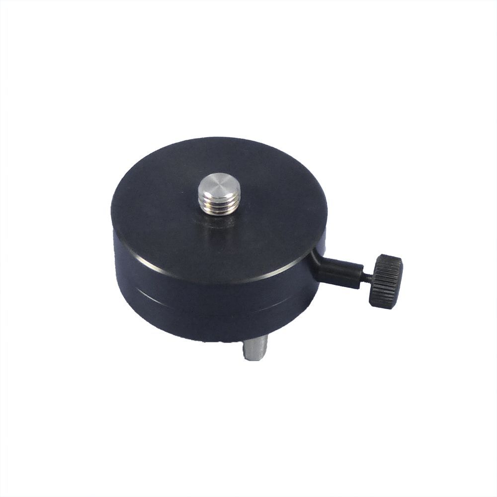 A black object with a screw on top of it