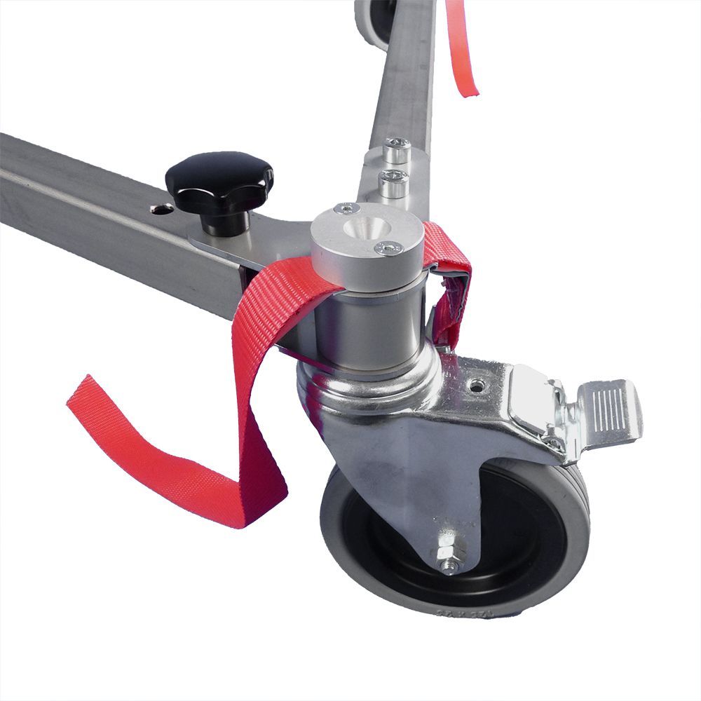 A close up of a wheel with a red strap attached to it