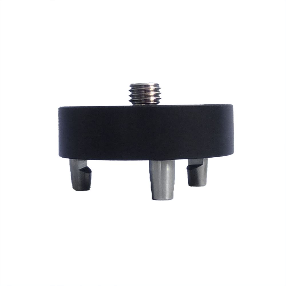 A black circle with a screw on top of it