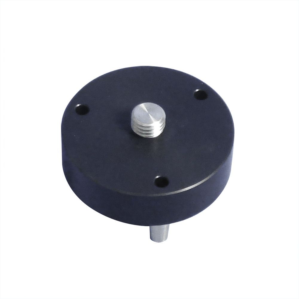 A black circle with a screw on top of it