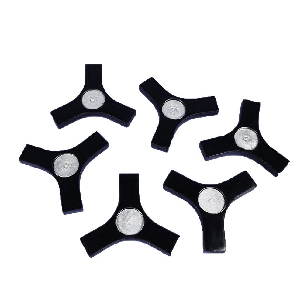 A white ball is sitting on top of a black stand.