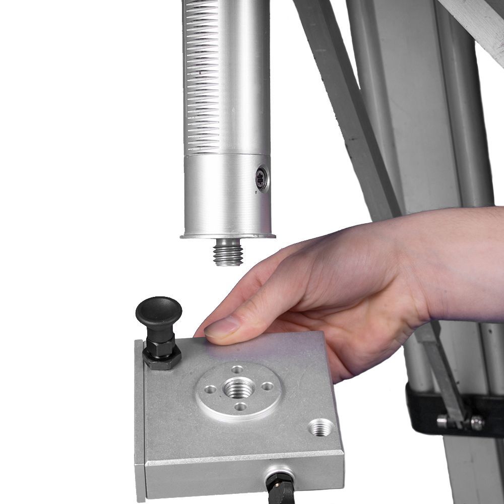 A person is holding a faro focus camera