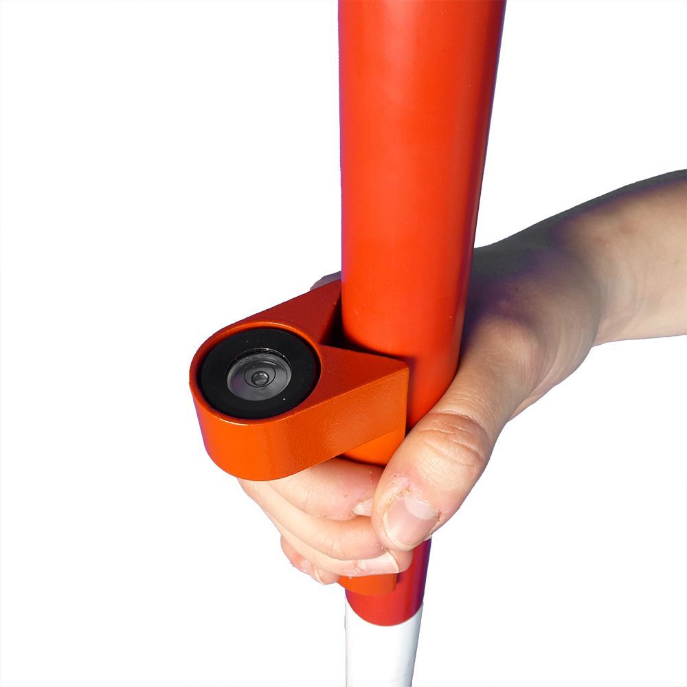 A person is holding a red and white pole in their hand