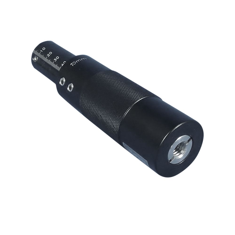 A close up of a black object on a white background.