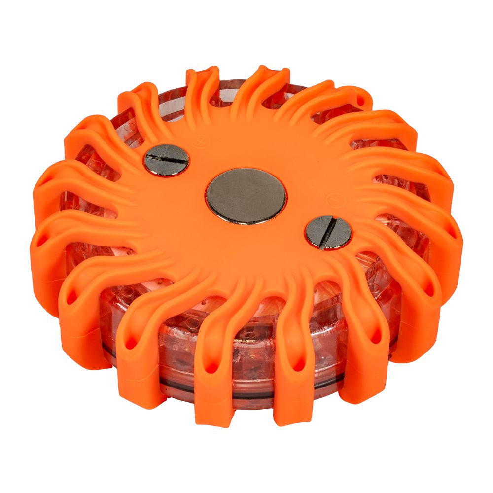 A round orange object with a magnet in the middle