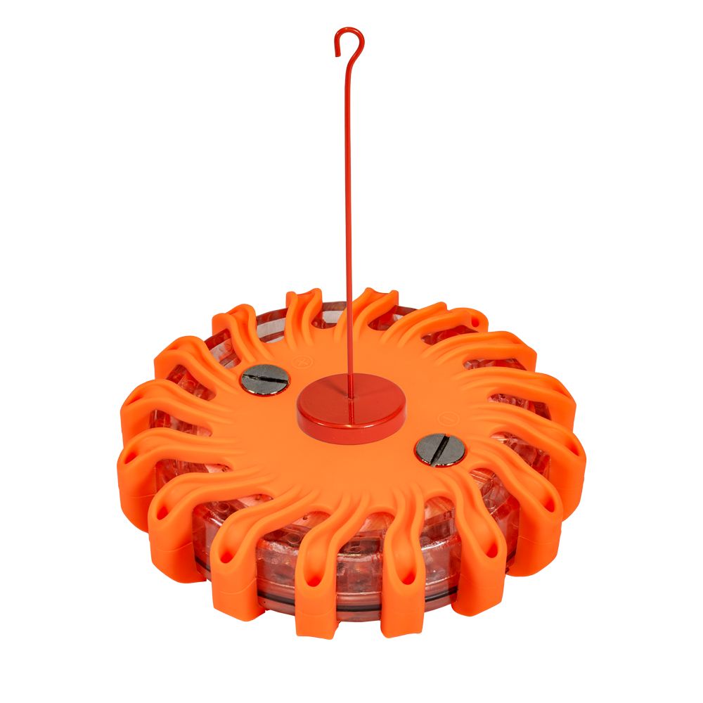 An orange emergency light with a red hook attached to it