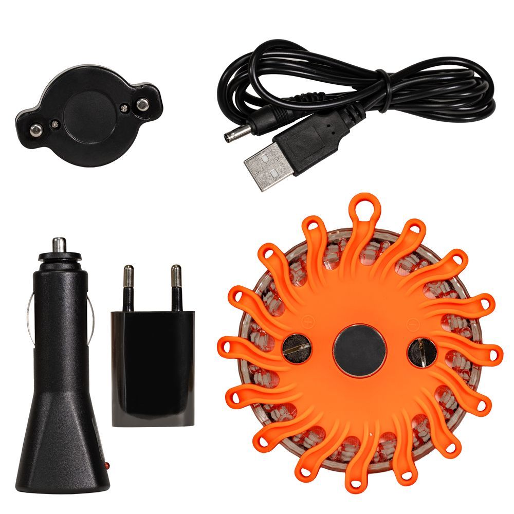 A round orange object with a magnet in the middle