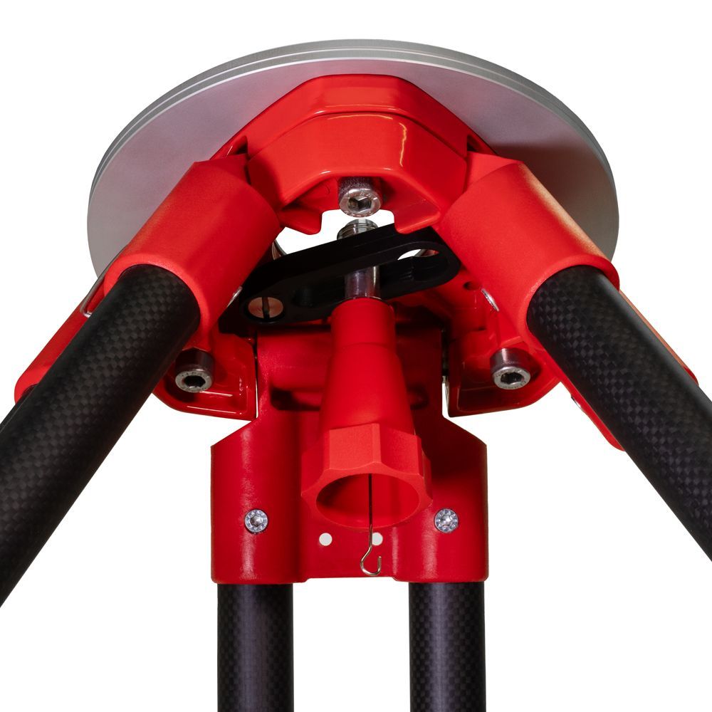 A close up of a red and black tripod on a white background