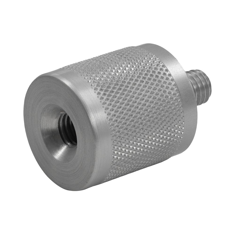 A metal cylinder with a hole in the middle on a white background