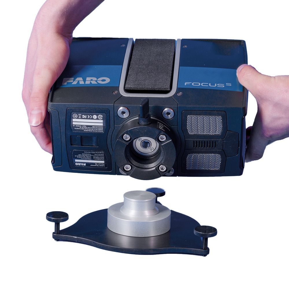 A person is holding a faro focus camera in their hands