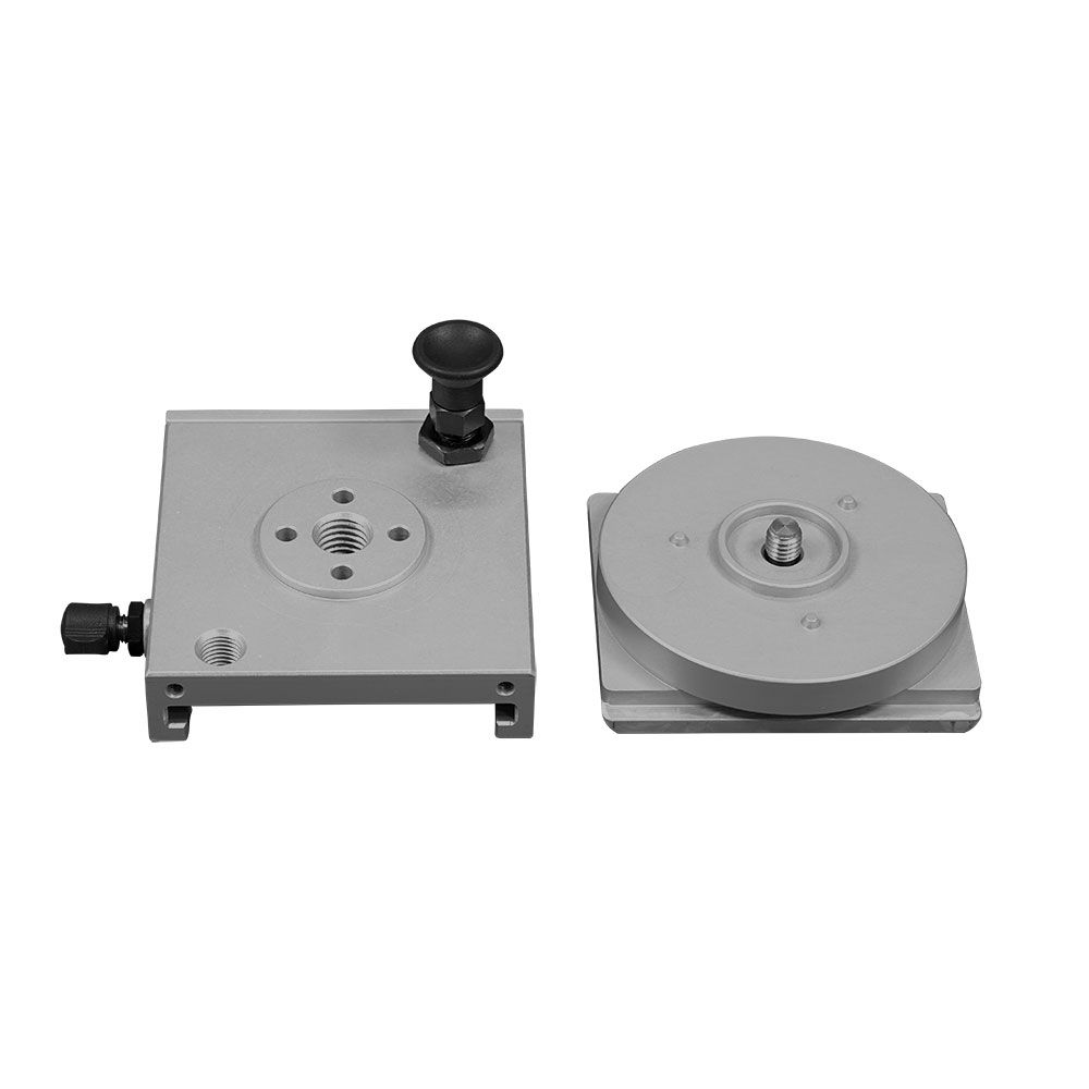A couple of pieces of metal sitting next to each other on a white surface.