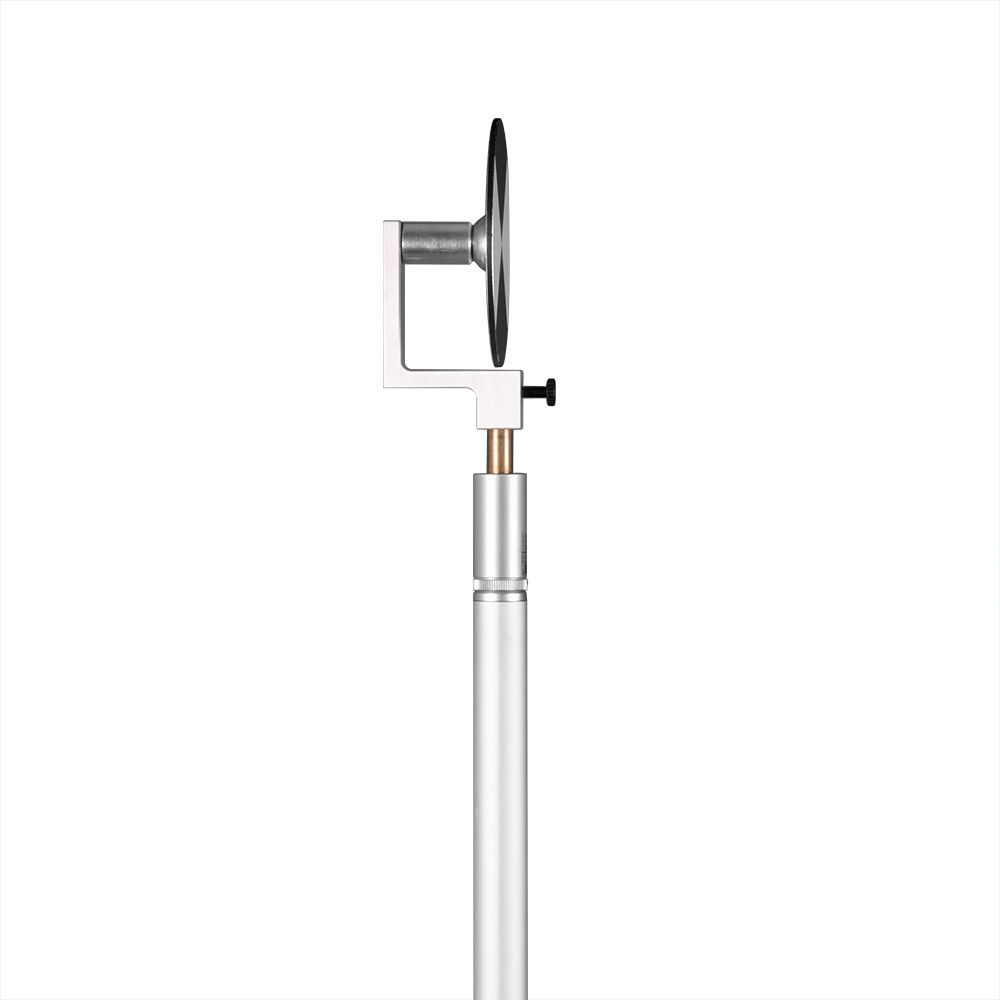 A white pole with a black and white circle on it.