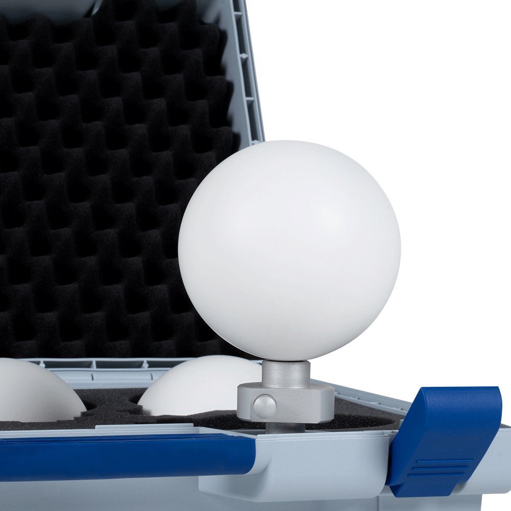A white ball is sitting on top of a blue case