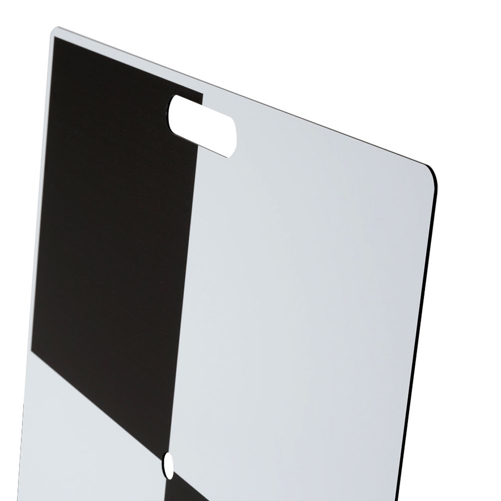 A black and white cutting board with a handle