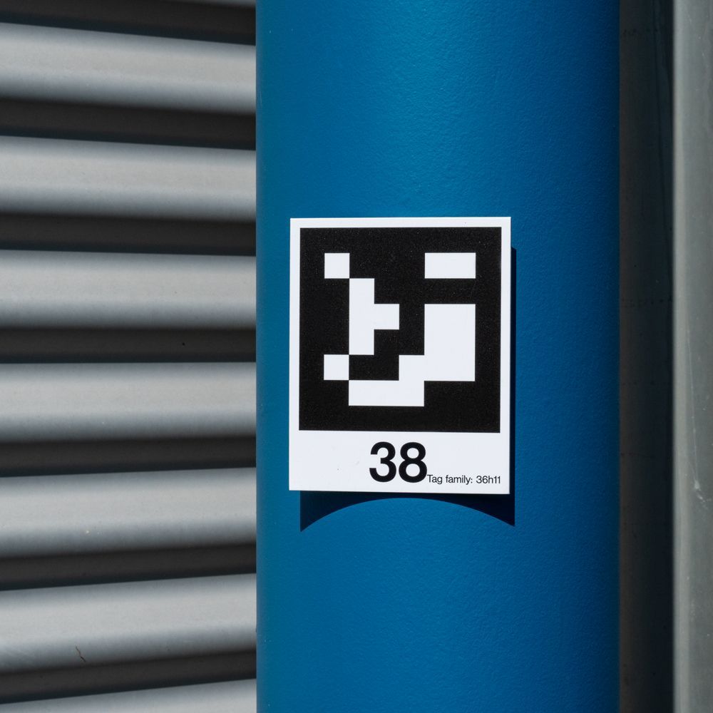 A blue pole with a sticker on it that says 38